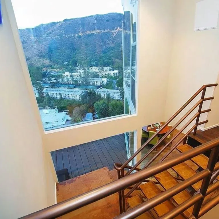 Grand Staircase & Entry — Floor-to-Ceiling Views